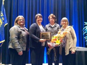 Ann Porath (middle-right) accepts her award at the national Equal Justice Conference
