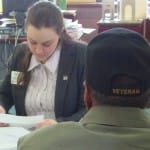 Ms. Altum-McNair working with a veteran at a Brief Advice Clinic.