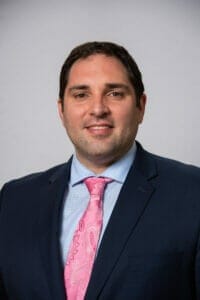 headshot of Matt Vincel - a man in professional suit. He is now managing attorney of Legal Aid's housing practice group